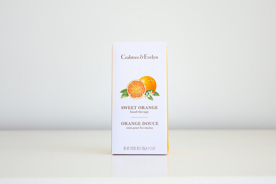 Quebec City, Quebec, Canada, March 3, 2026 - Crabtree & Evelyn Sweet Orange Hand Therapy packaging set on plain cream background