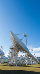 Large Satellite Dish Array Under a Clear Blue Sky