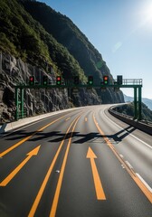 Mountain Highway With Traffic Signals And Directional Arrows Under Sunny Skies