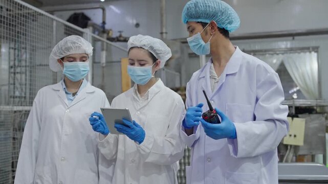 Quality control meeting food production facility team collaboration industrial environment close-up view efficiency improvement