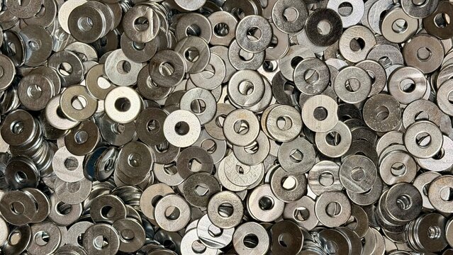 Pile of metal washers. Industrial hardware texture background.