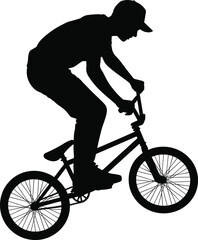 Black silhouette of a male BMX rider performing an extreme bicycle stunt in mid air for urban youth culture sports competition and adrenaline concepts. © Parimal