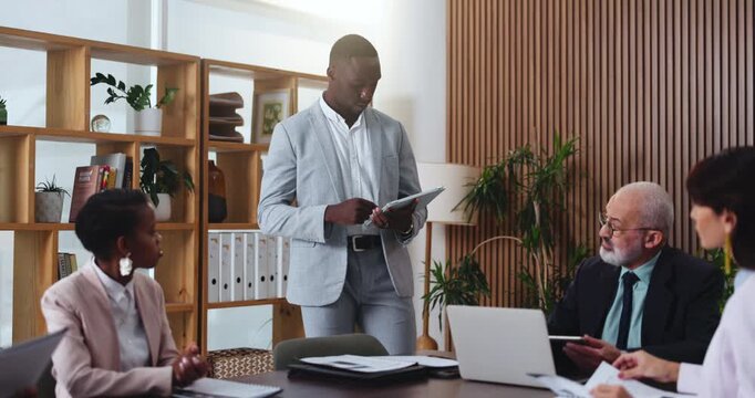 Design, proposal and tablet with business man in office boardroom for meeting or update. App, pitch and presentation with designer people in creative workplace for development, planning or vision