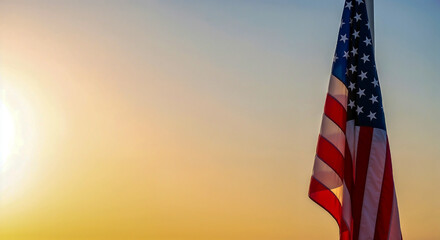 Flag at half-mast on Memorial Day at sunset symbolizing honor and solemn tribute