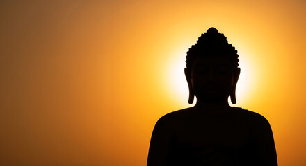  Buddha statue for Buddha's Birthday at sunset symbolizing enlightenment and inner harmony