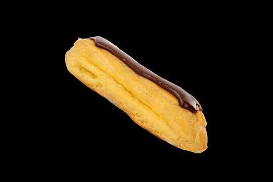 Sweet chocolate eclairs  on a blck background, close-up