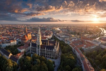 High-angle view of a city at sunset with a grand building and winding river