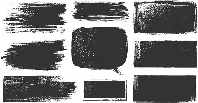Collection of nine dark gray textured brush stroke shapes and speech bubble on white background abstract
