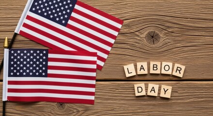 Obraz premium Two American Flags on Wooden Background with Labor Day Message