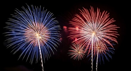 Vibrant fireworks explosions in blue red and white