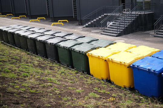 Lots of colorful plastic garbage containers. High quality photo
