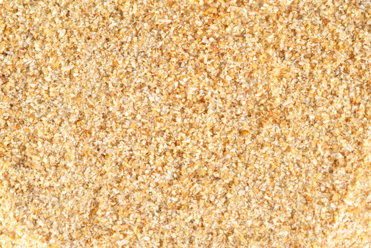 Full frame texture of dried minced freeze dried garlic spice.