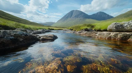 Papier peint photo  A mountain river with clear water running over smooth rocks .  © adobestocker1