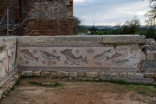Roman fish mosaic wall at Milreu ruins in Estoi, Algarve, Portugal