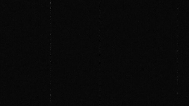 A black screen filled with grainy static and noise, simulating the look of an old damaged tape for a retro media background effect