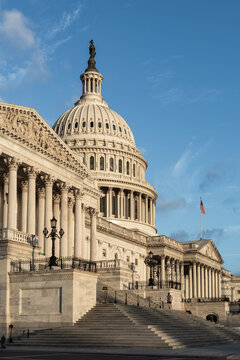 Washington, DC, USA - March 21st 2024 - Photo showing the Capitol building dome and front with the U.S. flag in Washington, DC, 