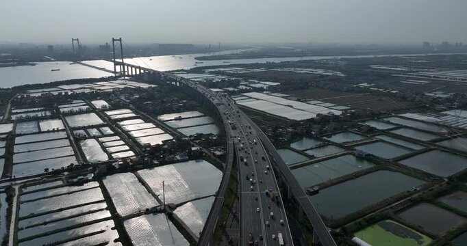 Aerial footage of landscape in Guangzhou city, China (Words on the bridge mean Nansha bridge in Chinese)