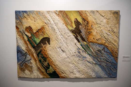 Jaen, Spain - 9 Dec 23: Textured abstract relief artwork on wall in museum exhibition, Spain