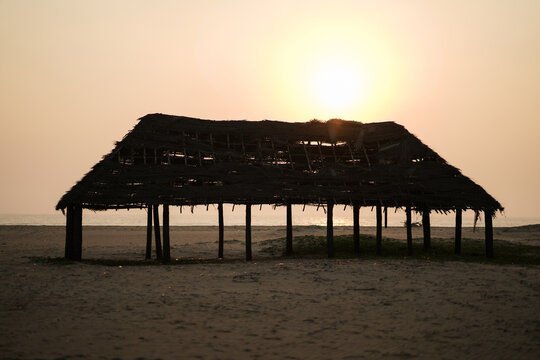 Sunset on the beach with beach roof