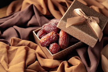 Dates fruits in golden gift box.