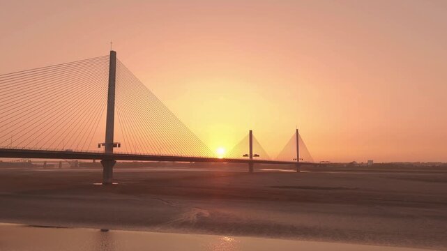 Liverpool, Merseyside, UK, June 19, 2025; Aerial 4K video footage of the Mersey Gateway toll bridge with stunning views over the River Mersey, Liverpool, UK.