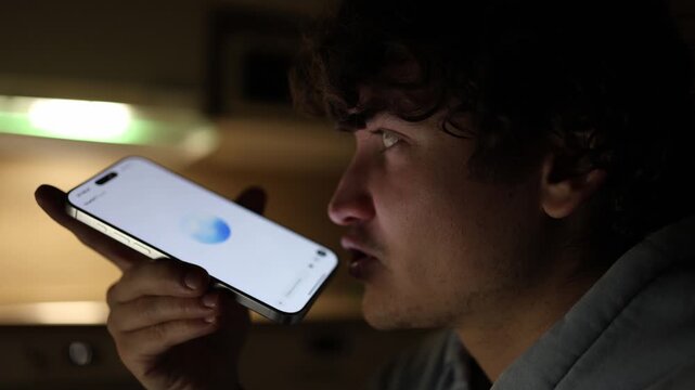 Student in dark room at night using smartphone talking with chatgpt asking academic questions ai assistant helping with homework and study tasks