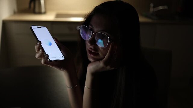 Teen girl sitting in dark room at night using smartphone communicating with chatgpt asking school questions and personal advice ai assistant concept