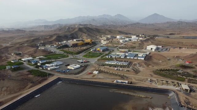 Aerial view of mining camp with tailings pond in peruvian andes