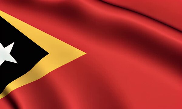 The flag of East Timor waving gently with a black triangle and white star