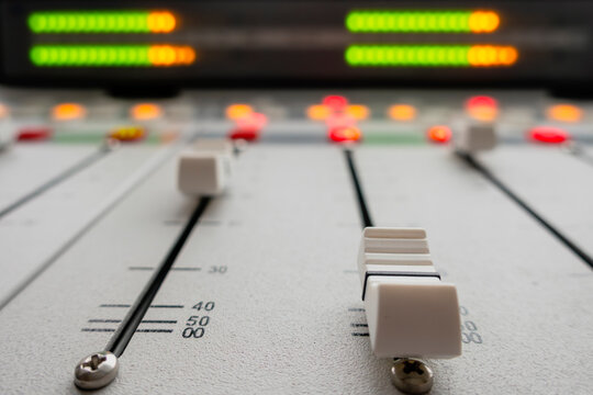 Audio mixing console faders with signal lights