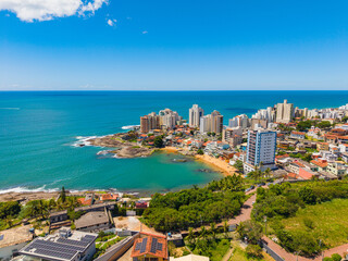 Fototapeta premium Aerial view of crowded beaches in downtown Guarapari during summer tourism season, Brazil