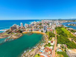 Fototapeta premium Aerial view of crowded beaches in downtown Guarapari during summer tourism season, Brazil 