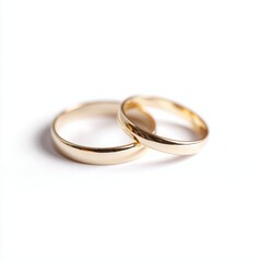 two golden wedding rings isolated on white background, clean minimal jewelry concept
