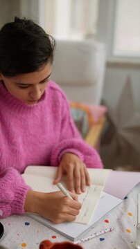 Meditative woman engrossed in writing and scheduling activities