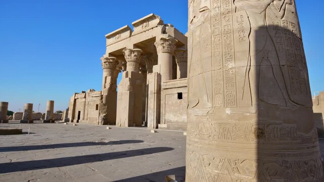 Kom Ombo temple ruins with double columns and composite capitals against clear blue sky in Egypt