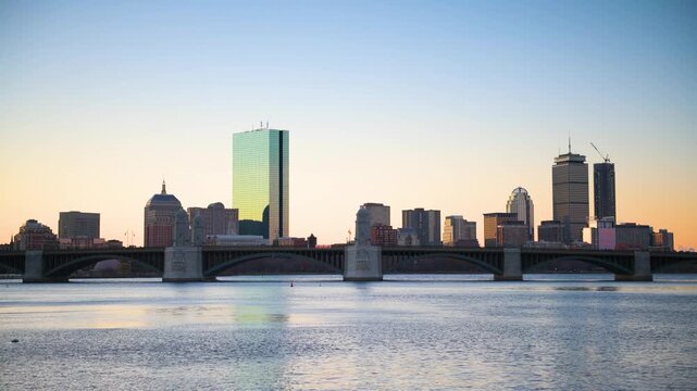 Boston, Massachusetts, USA downtown cityscape from across the Charles River at dawn.