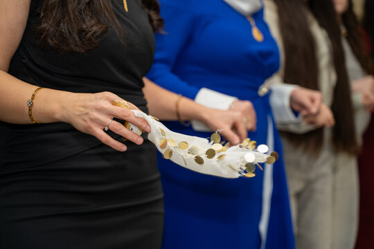 Women holding hands during traditional wedding dance (halay)