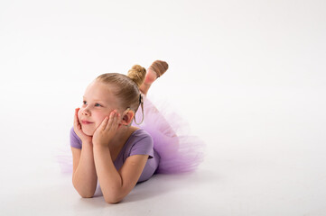 Naklejka premium Girl with cochlear implant lying and smiling to the side. Hearing recovery, childhood confidence, and inclusion in modern education and art.