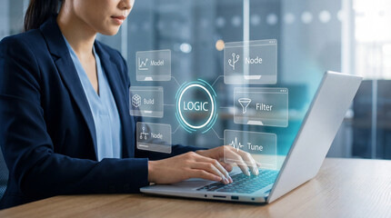 Asian businesswoman working on laptop with holographic logic workflow interface, data analysis and automation concept.