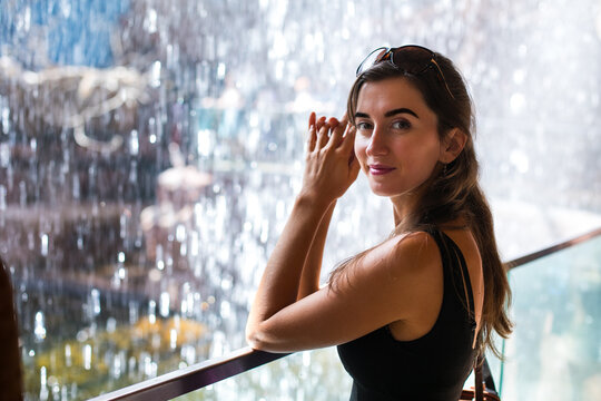 girl in front of a waterfall