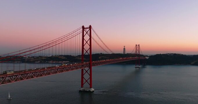 Aerial drone twilight skyline with 25th April bridge in Lisbon