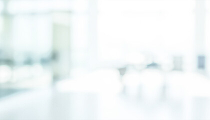 This image is blurred, showing an out-of-focus background with light colors and soft shapes suggesting a bright interior space with limited details.
