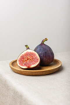 Fresh cut figs on a light background.