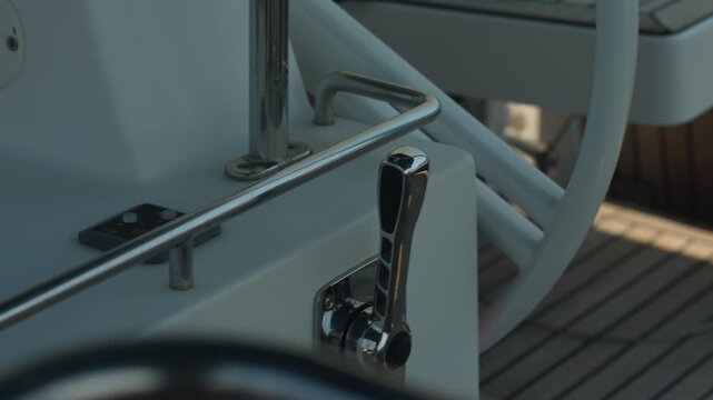 Closeup Throttle Lever Hand Control Skipper Adjusting Engine Control On Sailboat, Polished Chrome, Teak Deck, Precise Finger Movement, Calm Harbor Ambiance.