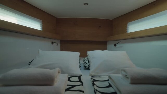 Bright Yacht Berth With Folded Towels, Plush Pillows And Stacked Linens, Overhead Skylight, Warm Wood Trim, Neat Compact Layout, Guestready Cabin Mood