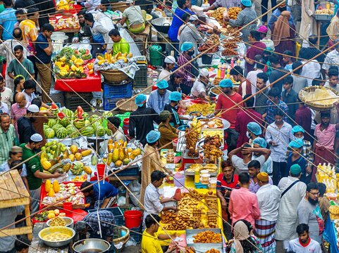 Dhaka, Bangladesh - 01 March 2026: Aerial view of Chawkbazar, a vibrant tapestry of bustling vendors and eager shoppers, a symphony of colors and textures under the open sky.