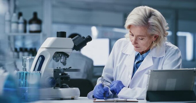 Writing, notes and woman with microscope, lab and medical study for mRNA vaccine and pharmaceutical. Clinic, scientist and research for HIV cure development, innovation and mature person with tech