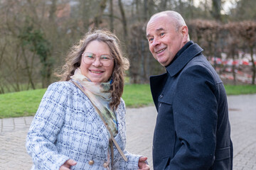 Fototapeta premium Smiling mature couple, happy Senior partners outdoors, warm relationship, active retirement lifestyle, positive emotions and togetherness, Positive lifestyle and emotional wellbeing, Active adulthood
