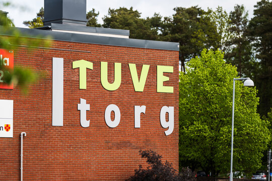 Gothenburg, Sweden - May 10 2025: Tuve Torg shopping center sign on brick wall.