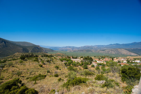 High-Angle Panoramic View of Chrisso Village and the Vast Olive Groves of the Crissaean Plain, Greece